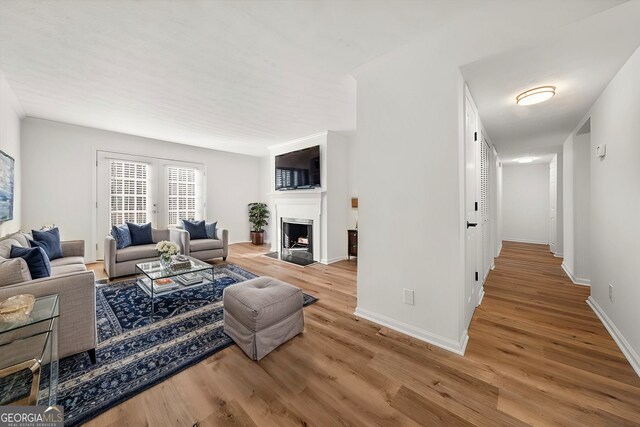 living room with light hardwood / wood-style flooring