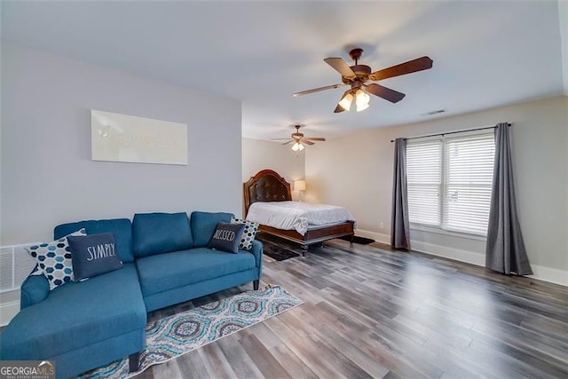 bedroom featuring wood-type flooring and ceiling fan