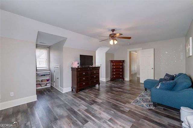 sitting room featuring ceiling fan and dark hardwood / wood-style floors