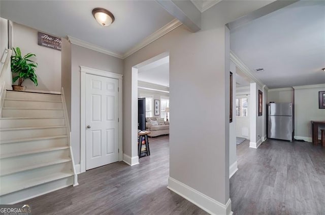 hall featuring hardwood / wood-style floors and ornamental molding