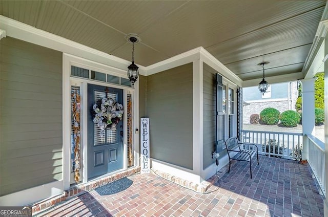 property entrance with covered porch