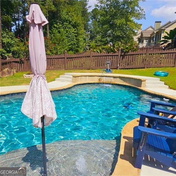 view of swimming pool featuring pool water feature