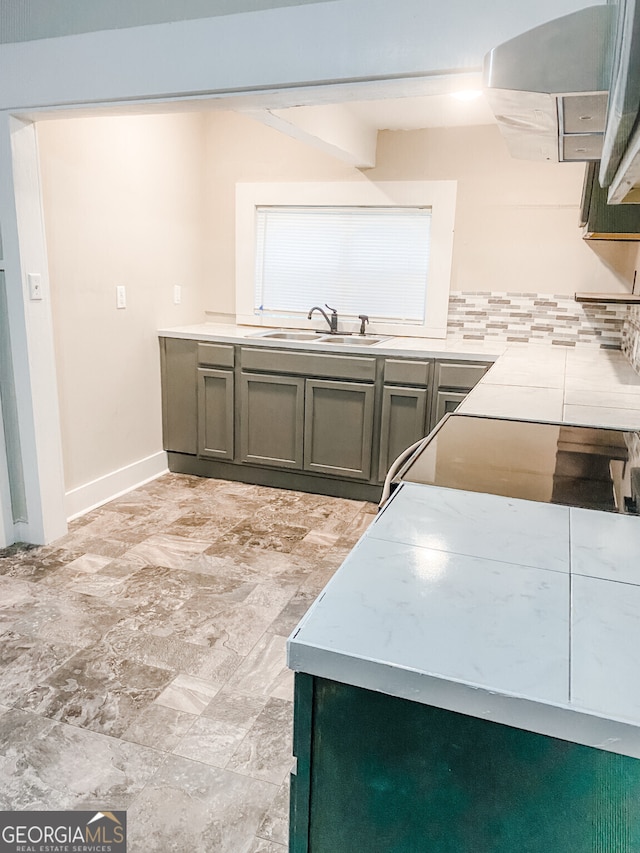 kitchen featuring sink and ventilation hood