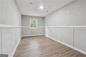 unfurnished room featuring wood-type flooring