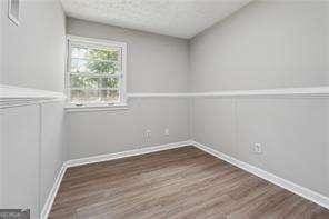 empty room featuring dark wood-type flooring