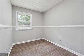 spare room featuring dark hardwood / wood-style flooring