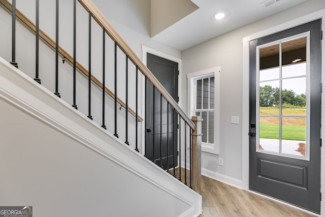 1611 Bethesda Church Rd, Carrollton, GA 30117 - entryway with light wood-style flooring, stairway, and recessed lighting
