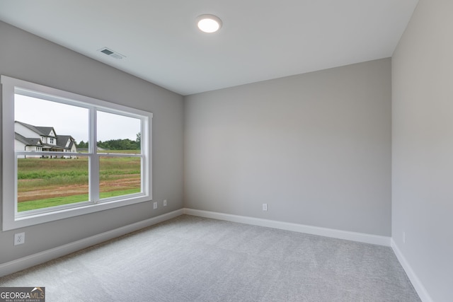 1611 Bethesda Church Rd, Carrollton, GA 30117 - empty room featuring carpet floors and baseboards
