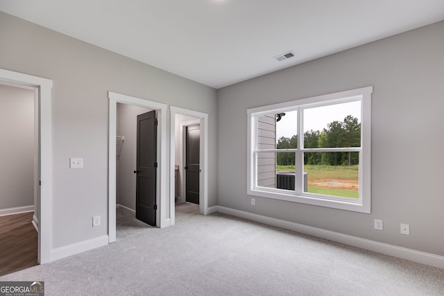 1611 Bethesda Church Rd, Carrollton, GA 30117 - unfurnished bedroom featuring carpet and a spacious closet
