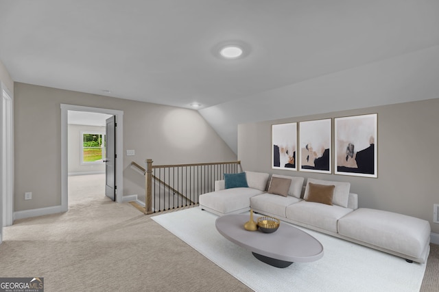1611 Bethesda Church Rd, Carrollton, GA 30117 - carpeted living room featuring baseboards and lofted ceiling