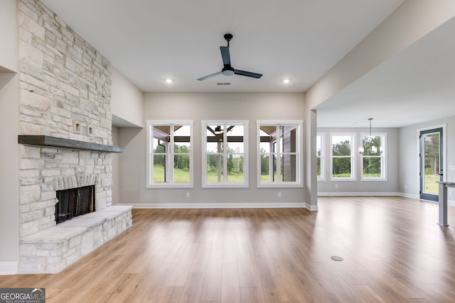 1611 Bethesda Church Rd, Carrollton, GA 30117 - unfurnished living room with a ceiling fan, a fireplace, wood finished floors, a chandelier, and recessed lighting