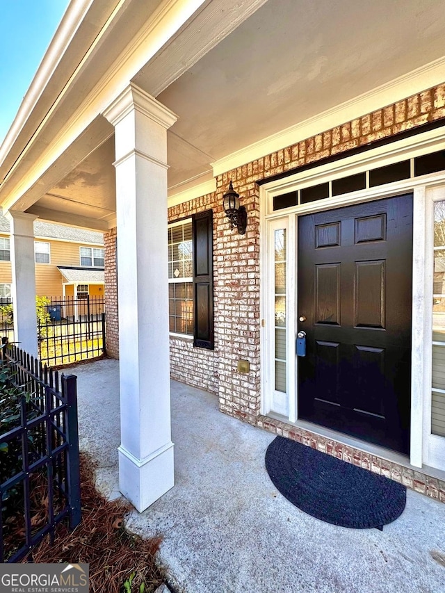 doorway to property with covered porch