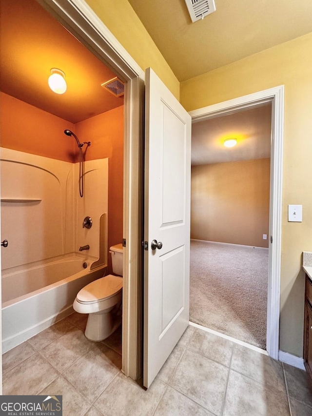 full bathroom with shower / tub combination, vanity, toilet, and tile patterned floors