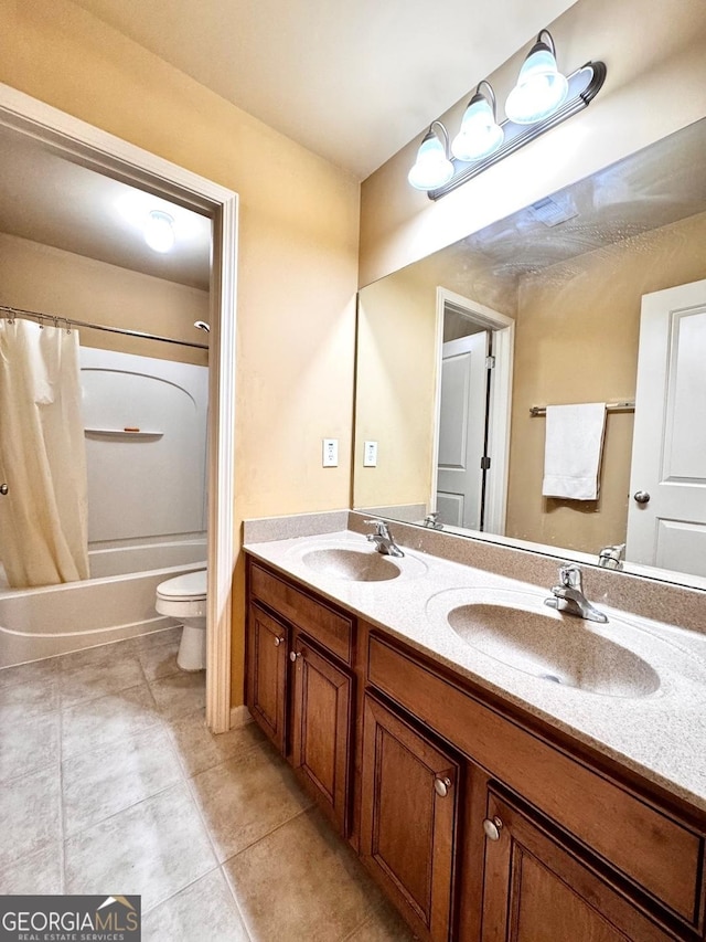 full bathroom featuring vanity, shower / tub combo with curtain, tile patterned floors, and toilet