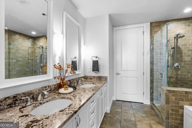 bathroom with vanity and walk in shower