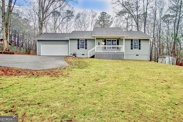 ranch-style house featuring a porch, a garage, and a front lawn