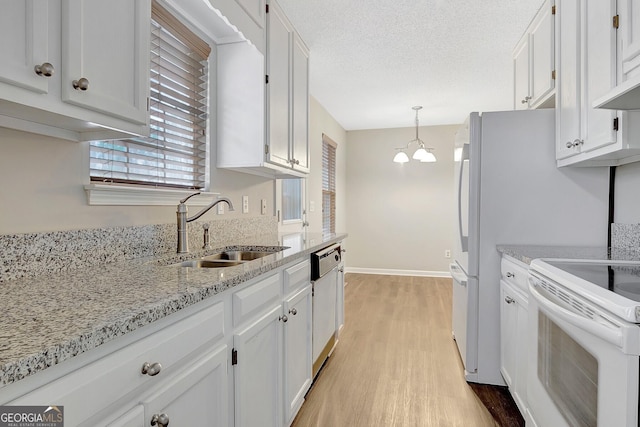 kitchen with white cabinetry, white electric range oven, sink, and pendant lighting