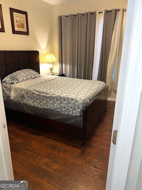 bedroom featuring dark hardwood / wood-style floors