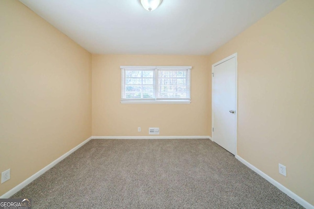 unfurnished room featuring carpet flooring