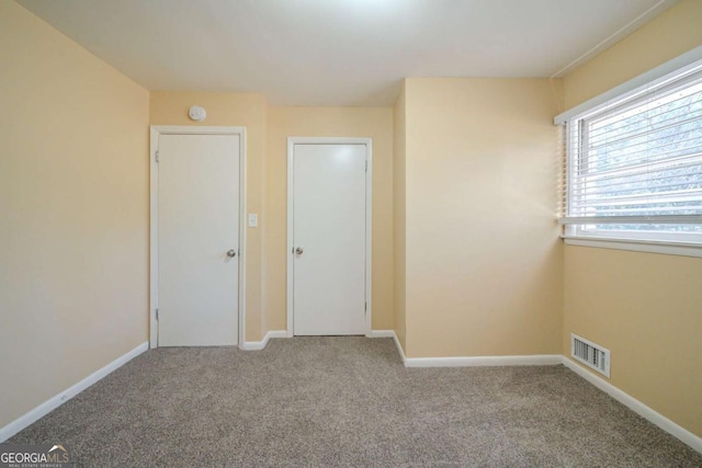 unfurnished bedroom featuring carpet flooring