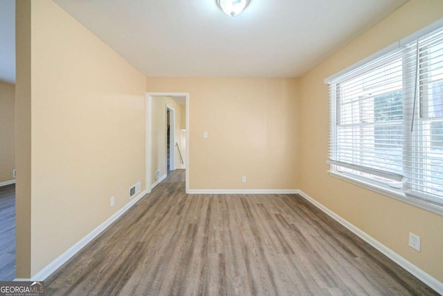 spare room featuring hardwood / wood-style flooring