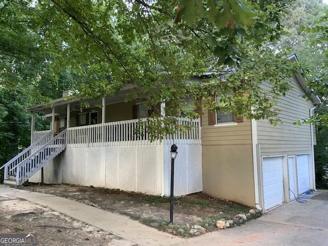 view of front facade with a garage and covered porch