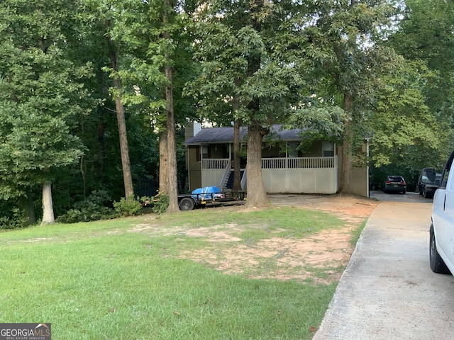 view of yard featuring covered porch