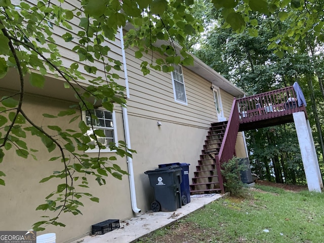 view of side of home with a deck