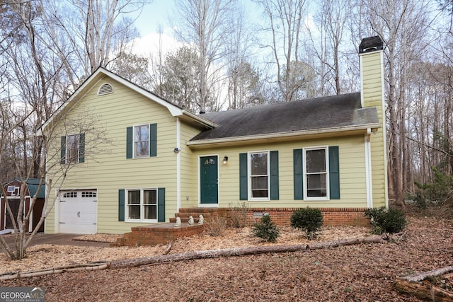 split level home featuring a garage