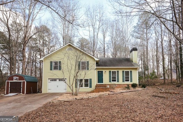 tri-level home featuring a garage and a storage unit