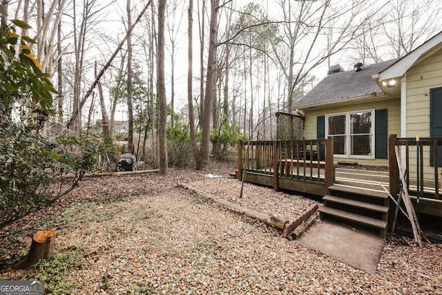 view of yard featuring a wooden deck