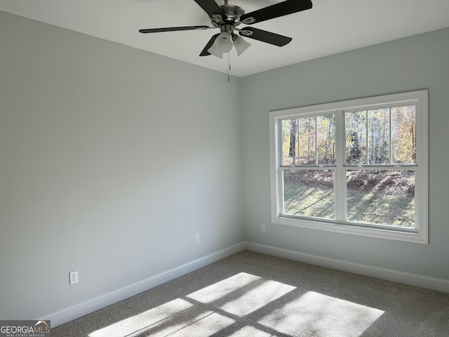 carpeted empty room with ceiling fan