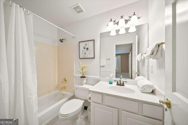 full bathroom with vanity, shower / tub combo, and toilet