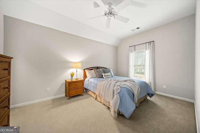 carpeted bedroom with ceiling fan and lofted ceiling