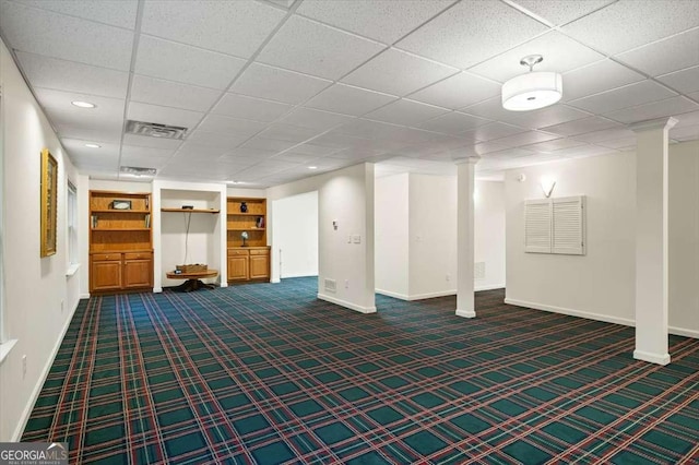 basement with dark carpet