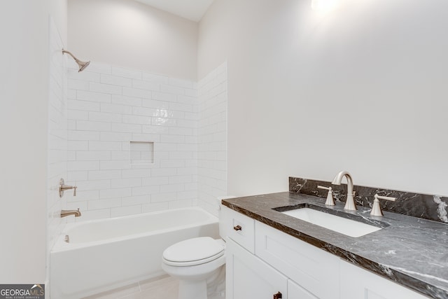 full bathroom with vanity, toilet, and tiled shower / bath