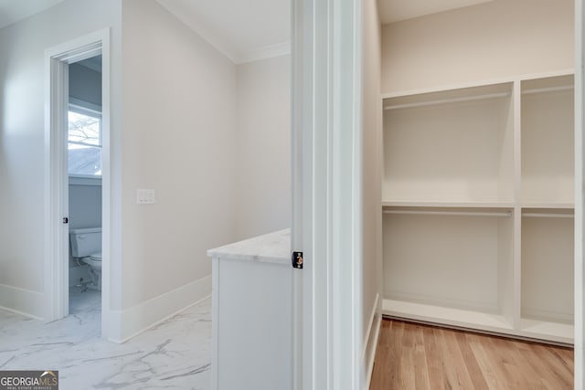 interior space featuring vanity and toilet