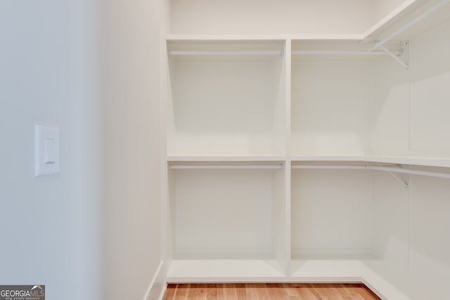 walk in closet featuring hardwood / wood-style floors