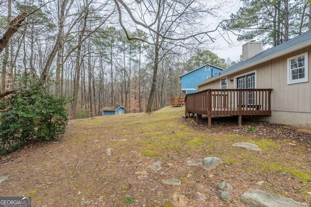 view of yard featuring a wooden deck