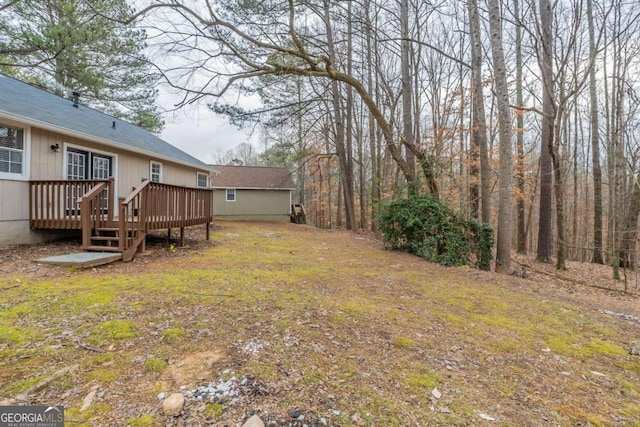 view of yard with a wooden deck