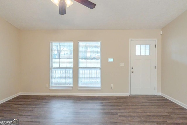 entryway featuring ceiling fan and dark hardwood / wood-style flooring