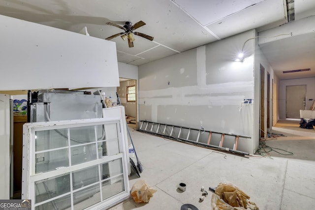 interior space with ceiling fan