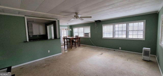 spare room with crown molding, cooling unit, and ceiling fan