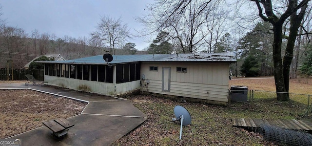 rear view of house with a sunroom