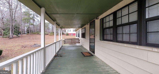 wooden terrace featuring a porch