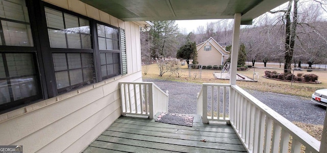 wooden terrace featuring a porch