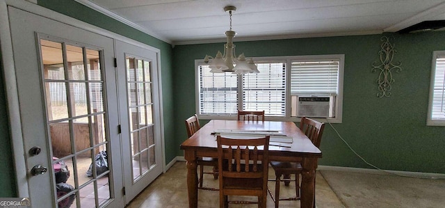 dining room with cooling unit, crown molding, tile patterned flooring, and an inviting chandelier