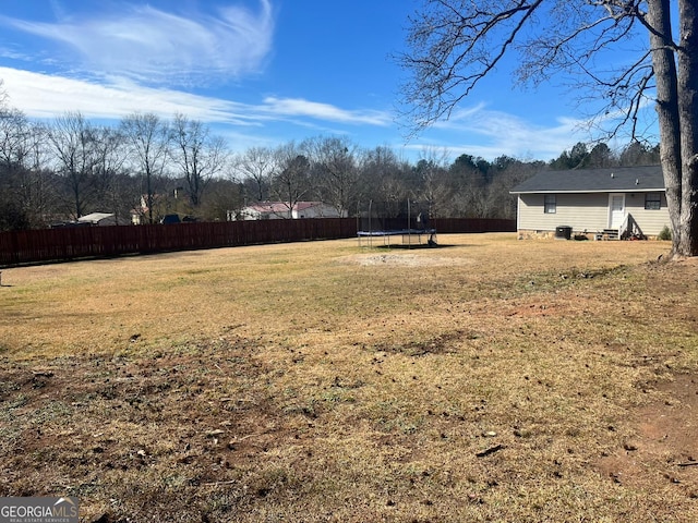 view of yard with a trampoline