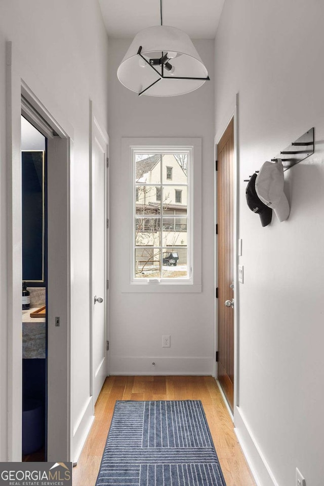 hall with light hardwood / wood-style flooring