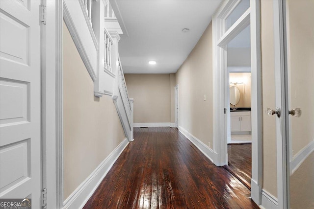 hallway featuring dark hardwood / wood-style flooring